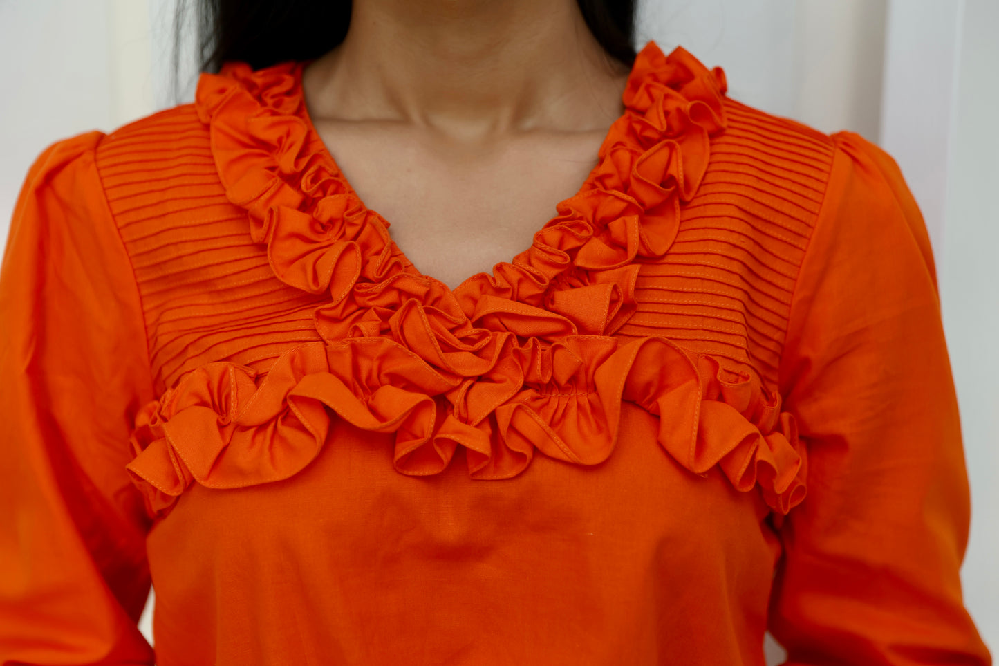 Orange frill top